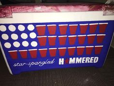 a large blue and white cooler sitting on top of a carpeted floor