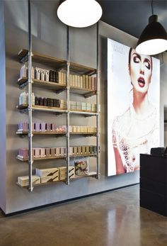 a display in a store with shelves full of cosmetics