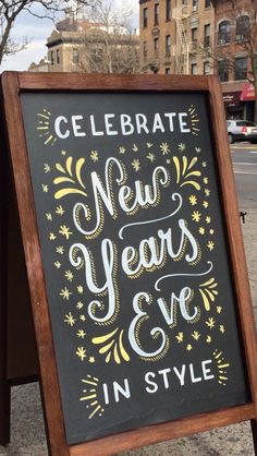 a sign that says celebrate new year's eve in style on the side of a street