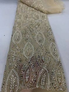 This high quality Fabric is measured in 5 Yards With Embroidered Beading and Sequin. It is soft, very delicate and beautiful. This high Quality Fabric is made with Fashion embroidered rhinestones can be used in making party wedding dresses, skirts, shawls, scarves and other other fashion apparels as you would like. Size : Length : 5 yards (180 inch). Width: 50 inch (Please allow slight deviation for the measurement data ,±1 inch) Material: 100% Polyester, Tulle Lace Fabric, Eco-Friendly embroidery Party Wedding Dresses, Making Fabric, Luxury Fabric, Designer Dress, Tulle Lace, Champagne Gold, Wedding Party Dresses, Luxury Fabrics, Lace Fabric