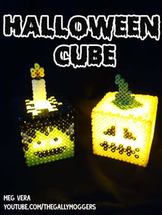 two legos made to look like halloween cubes are shown in yellow and green