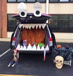 a car decorated for halloween with decorations on the back