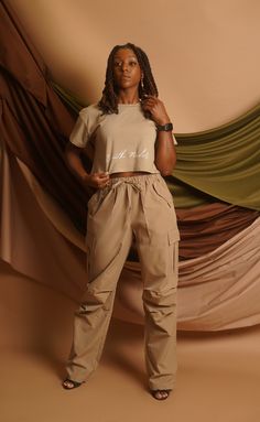 The Parachute Cargo Pant is the perfect pair to our Signature Cropped T-shirt. With 2 front and side pockets, drawstring waistband and additional belt loops, these pants are not only stylishly comfortable but super functional as well. Details: – Wide straight leg cargo pants– Elastic band with straps– Pockets on side– oversized fit – Model size 5′ 10″ wearing size M Parachute Cargo Pants, Straight Leg Cargo Pants, Loose Crop Top, Parachute Cargo, Oversized Crop Top, Studio Poses, Cropped T Shirt, Cargo Pants Women, Cargo Pant