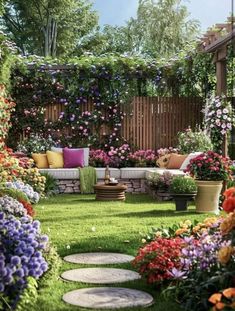 an outdoor seating area with flowers in the grass and stone stepping stones on the ground