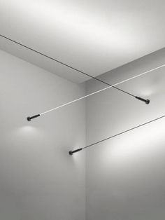 two lights that are on the side of a wall