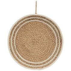 three round placemats with rope hanging from the top, on a white background