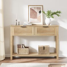 a white vase sitting on top of a wooden table next to a shelf filled with books