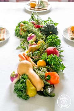 a long table with many different types of vegetables on it