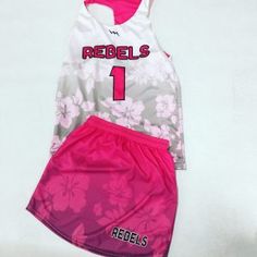 the jersey and shorts are both pink and white with flowers on them, but no one is wearing it