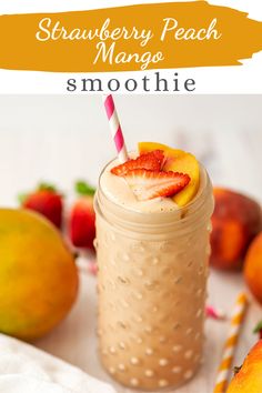 a smoothie in a mason jar with strawberries and peaches on the side