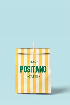 a yellow and white striped bag with the words positanoo cafe on it