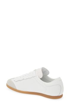 The absence of the signature sidewall overlays lightens the look and feel of a low-top leather sneaker with a logo debossed tongue and iconic basting stitch. Lace-up style Removable insole Leather upper/textile and leather lining/rubber sole Made in Italy Men's Designer Shoes White Sports Sneakers With Stitched Sole, White Low-top Sneakers With Stitched Sole, White High-top Sneakers For Streetwear With Stitched Sole, Calf Leather Sneakers With Gum Sole And Round Toe, Sporty Calf Leather Sneakers With Vulcanized Sole, Sporty Calf Leather Sneakers With Gum Sole, Casual Calf Leather Sneakers With Gum Sole, Designer Low-top Sneakers With Stitched Sole, Designer Low-top Sneakers With Gum Sole