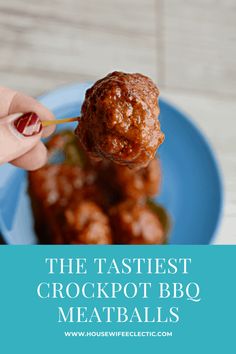 a person holding a meatball in their hand with the words, the fastest crockpot bbq meatballs