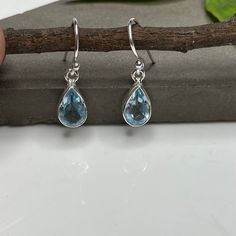 These elegant drop earrings are crafted from 925 sterling silver and adorned with natural Blue Topaz gemstones. The perfect complement to any ensemble, especially a white dress, these earrings feature a dazzling light blue topaz set in sterling silver that enhances their sparkle. They dangle from hypoallergenic, nickel-free sterling silver French hooks. I T E M D E T A I L S Stone: Natural Blue Topaz Shape: Pear Weight: - 2.60 Grams Your jewelry will be elegantly packaged. If any items are inten Silver Topaz Teardrop Earrings, Silver Teardrop Topaz Earrings, Blue Topaz Teardrop Earrings For Anniversary, Blue Topaz Dangle Earrings For Gift, Topaz Dangle Earrings For Gift, Fine Jewelry Sterling Silver Teardrop Earrings, Blue Topaz Drop Earrings For Gift, Teardrop Blue Topaz Birthstone Earrings, Blue Topaz Teardrop Birthstone Earrings