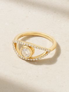 Melissa Joy Manning's ring is shaped to resemble an 'Evil Eye' motif, which is believed to bestow protection upon the wearer. It's crafted from 18-karat gold and set with a full-cut diamond framed by a halo of pavé stones. Make it your everyday signature. Modern Yellow Gold Moissanite Rings, Fine Jewelry Gold Diamond Ring With Halo, Gold Halo Diamond Ring Fine Jewelry, Gold Diamond Ring With Halo, Fine Gold Diamond Ring With Halo, Diamond Halo Ring In Gold, Diamond Halo Open Ring Jewelry, Modern Yellow Gold Ring With Halo Design, Diamond Halo Design Open Ring Jewelry