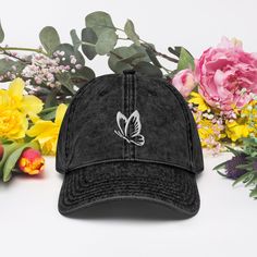 Introducing our Butterfly Vintage Embroidered Cap, a fusion of edgy design and casual comfort. Meticulously crafted from premium 100% cotton twill, this cap boasts an embroidered Butterfly Vintage motif paired with a captivating washed-out effect for that cherished vintage charm.  Make a statement with this iconic headwear that seamlessly combines durability, individuality, and a touch of retro flair. 🦋 🧵 Product Details * Material: Crafted from high-quality 100% cotton twill, guaranteeing durability and comfort in any setting. * Design: Stand out with the intricately embroidered Butterfly Vintage motif, adding a unique and edgy touch to your ensemble. * Style: Embrace the relaxed feel of the 6-panel unstructured cap with a low profile, ensuring a comfortable fit for extended wear. * Buc Trendy Cotton Baseball Cap With Flat Bill, Cotton Snapback Hat, Cotton Snapback Hat With Embroidered Logo And Curved Brim, Trendy Embroidered Cotton Snapback Hat, Cotton Trucker Hat With Embroidered Logo And Curved Brim, Adjustable Cotton Trucker Hat With Embroidered Logo, Trendy Cotton Snapback Hat With Curved Brim, Trendy Cotton Adjustable Snapback Hat, Trendy Adjustable Fit Cotton Snapback Hat