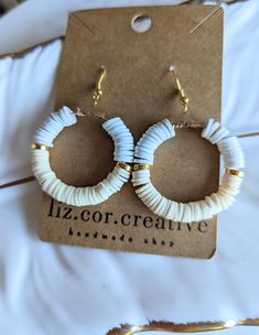 "+ Style name: Yellow and White with Gold Hoops + beaded hoop earrings with pale yellow and whiter clay and gold beads + Hoops are 1 1/2\" diameter + Gold hoops with earwire If you would like to see any other color please message me. + All lizcorcreative hoop earrings will come packaged on a hand-stamped kraft earring card in a clear sealed bag Free Domestic Shipping Follow along Instagram https://www.instagram.com/lizcorcreative/ Facebook https://www.facebook.com/profile.php?id=100063235479850 Pinterest https://www.pinterest.com/lizcorrinne/" Heishi Bead Earrings, Casual Earrings, Yellow Jewelry, Earring Card, Earrings Summer, Jewelry Elegant, Summer Earrings, Elegant Casual, Summer Earring