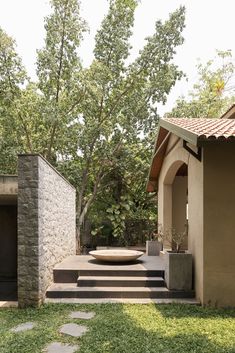 an outdoor courtyard with steps leading up to it