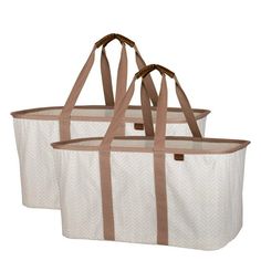 two white bags with brown handles and straps on the sides, one has a beige stripe