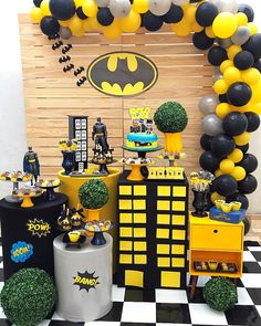 a batman themed party with balloons and decorations