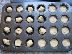 an uncooked muffin tin with several cupcakes in it