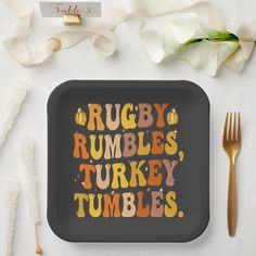 a black tray with the words rugby rumbles, turkey tumbles on it