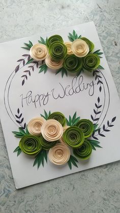 an image of a happy wedding card with paper flowers