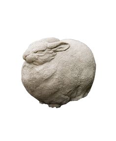 a stone sculpture of a sheep on a white background