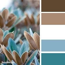 the color scheme is blue, brown and white with some green leaves on top of it