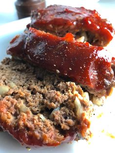 the meatloaf is covered with sauce and spices