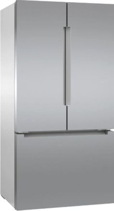 a silver refrigerator freezer sitting on top of a white floor next to a wall