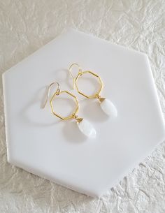 Add an elegant finishing touch to your look with these new Geometric Moonstone Earrings.Earrings feature a gold octagon shape that is accented with a marquise shaped natural Moonstone. Earrings dangle approximately 1 3/4 inches in length.Details:* Gold Vermeil Octagons (gold vermeil is pure gold over sterling silver) Size: 20 mm* Naturall faceted marquise shaped Moonstones Size: 18 mm* Genuine Gold Filled Ear Wires (not plated)* Earrings hang down 1 3/4 inches* Lightweight and Comfortable* Great Early Fall Weddings, Fall Wedding Guest, Well Dressed Women, Fall Wedding Guest Dress, Octagon Shape, What To Wear To A Wedding, Moonstone Earrings, Gold Geometric, Formal Style