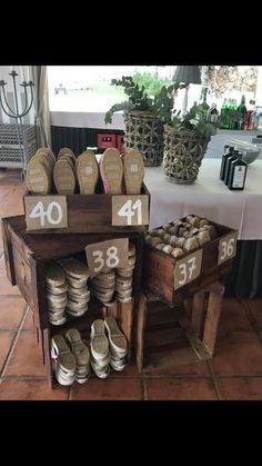 there is a table with shoes on it and numbers for each item to be sold