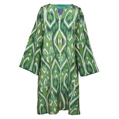 Introducing the Gallipoli Green Ikat Tunic, a captivating blend of Italian flair and exotic allure. With its lush green ikat print inspired by the landscapes of Gallipoli, this tunic exudes effortless elegance and timeless charm. Throw on this tunic over pants (or wear it as a dress!) and let it transport you to sun-drenched shores and endless summer days, embodying the essence of Italian sophistication with a global twist. This Gallipoli Green silk is exclusively printed for Pax Philomena in Co Elegant Long Sleeve Green Tunic, Silk Printed Tunic With Long Sleeves, Elegant Green Tunic Kurta, Printed Silk Tunic With Long Sleeves, Green Silk Tunic Kaftan, Green Printed V-neck Kurta, Green V-neck Printed Kurta, Traditional Ikat Print Tunic Dress, Luxury Multicolor Tunic With Printed Motifs