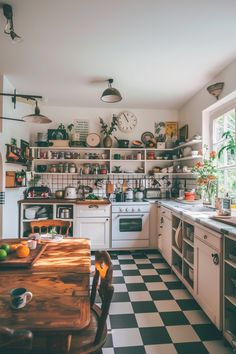 a kitchen with black and white checkered flooring next to an oven, stove top oven