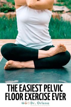 a woman sitting in the middle of a yoga pose with her hands behind her head