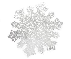 white paper cut outs are arranged in the shape of an intricate pattern on a white background