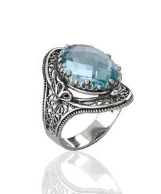 This gorgeous handmade filigree art statement ring will draw all the right kind of attention. Made of sterling silver, it is oxidized and highly polished. The ring face is 0.97" / 24.70 mm X 0.65" / 16.50 mm. Its elegant minimal design is a perfect accessory to any outfit, making this anniversary gift or birthday gift the best option for everyday wear. Sizes from 5 to 12.5 with half sizes. A stunning ring for any occasion. Comes with a gift box, velvet pouch, silver polish cloth and care card to Birthday Gemstones, Art Statement, The Ring Face, Silver Polish, Blue Topaz Gemstone, Blue Stone Ring, Statement Ring Silver, Outfit Making, Sterling Silver Filigree