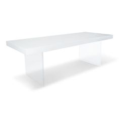 a white table sitting on top of a white floor