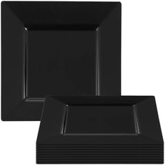 black square plates stacked on top of each other with one empty plate in the middle