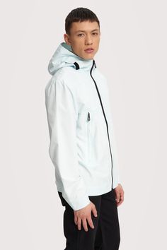 Silas is the perfect fusion of performance and fashion, offering a mid-length windbreaker that can handle the wettest conditions with ease. Its wind- and waterproof construction ensures you stay dry and comfortable, while the long zip pockets keep your essentials safe and protected. This style embraces the classic features you love in a nylon windbreaker, but it's crafted from cruelty-free and vegan materials, making it a conscious and stylish choice for any outdoor adventure. Marina Bay, Outdoor Adventure, Mid Length, Cruelty Free, Rain Jacket, Zip Pockets