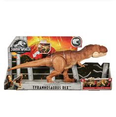 a toy tyranosaurus is in the box