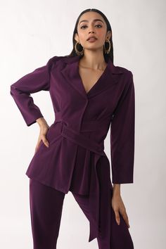 Purple crepe shirt with belt tie-up detailing, spread collar, and full sleeves. Comes with pant.
Component: 2
Pattern: Solid
Neckline: Spread collar
Sleeve Type: Full
Fabric: Crepe
Color: Purple
Other Details: 
Closure : Button
Occasion: Party - Aza Fashions Belted Long Sleeve Pantsuit For Office, Belted Long Sleeve Office Pantsuit, Belted Long Sleeve Pantsuit For Work, Belted Pantsuit For Office Wear In Fall, Chic Belted Pantsuit For Office, Belted Notch Lapel Pantsuit For Office, Office Pantsuit With Notch Lapel And Belted Detail, Office Pantsuit With Belt And Notch Lapel, Office Notch Lapel Belted Pantsuit