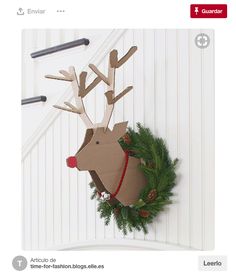 a paper reindeer head hanging on the wall