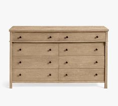 the chest of drawers is made from wood and has six drawers on each side, with two