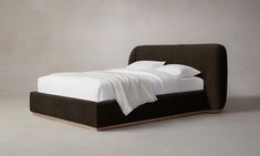 the bed is made up and ready for someone to use it in their home or office