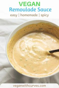 a bowl of vegan remoulade sauce with a spoon in it