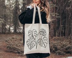 Monstera Tote Bag, Plant Lady Gift Shoulder Bags, Botanical Mama Totes, Cute Houseplant Print Shopping Bag,Funny Monstera Leaves Canvas Tote 👉 Product Details: The T-Shirts, V-Necks, youth and baby suits(onesie) are unisex.👈 👉Reading the Sizing Chart: Please note that the sizing chart includes the measurements of one side of the shirt, not the circumference. 👈 👉Please review all the sizing charts that were added in the product pictures.  👚 Women: Shirts will have a looser fit when choosing Bag Painting, Monstera Leaves, Plant Lady, Monstera Leaf, Product Pictures, Sizing Chart, Positive Affirmations, Types Of Shirts, Canvas Tote