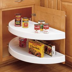 two tiered spice rack with spices and canned food