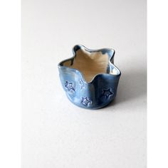 a small blue ceramic bowl with stars on it